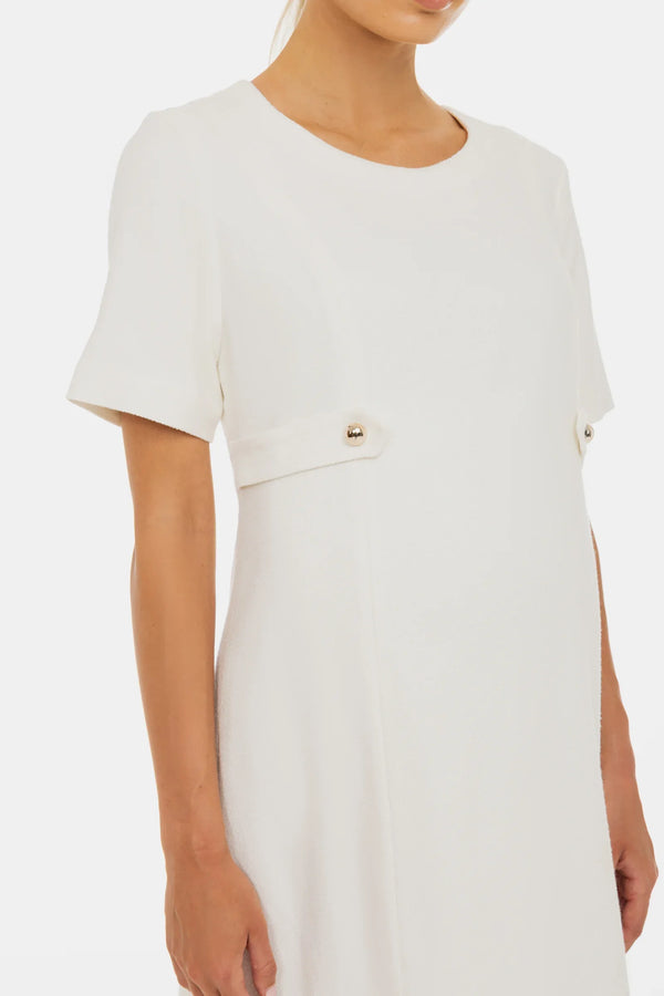 Elegantes Umstandskleid aus Bouclé mit goldenen Details